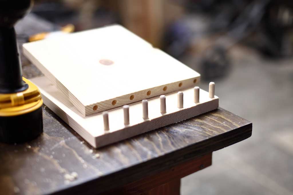 dowels inserted for DIY Offsetting bookshelf