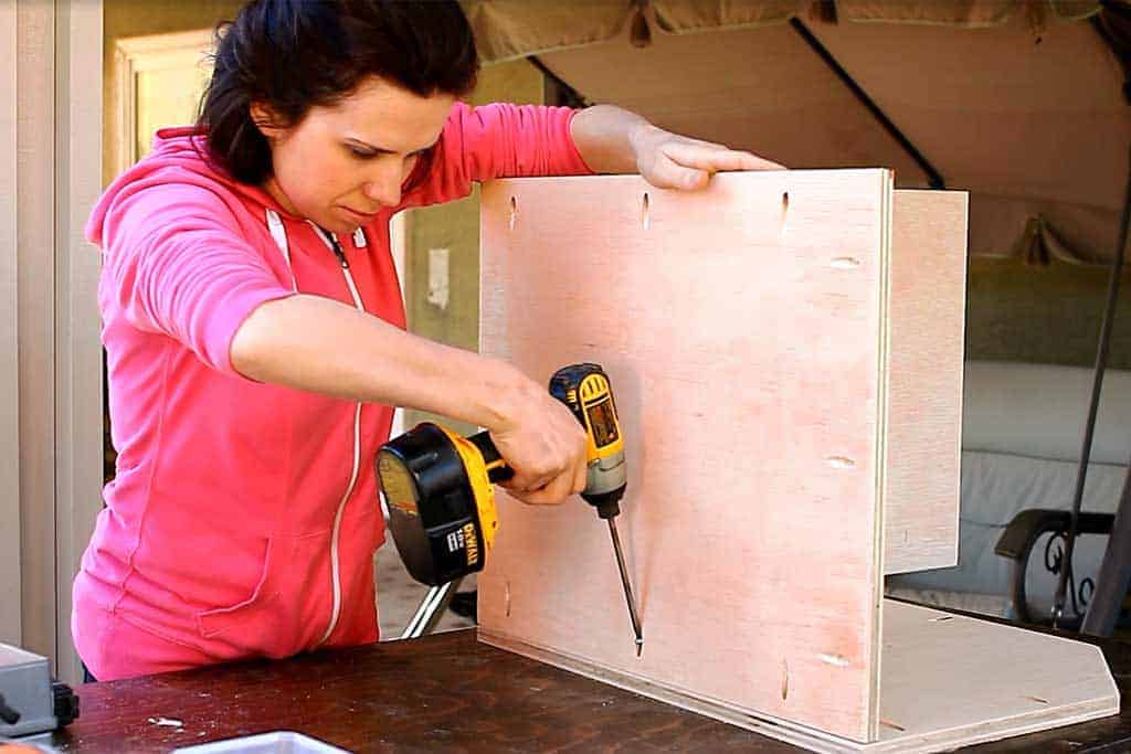 attaching the side section of the DIY Storage for Toys