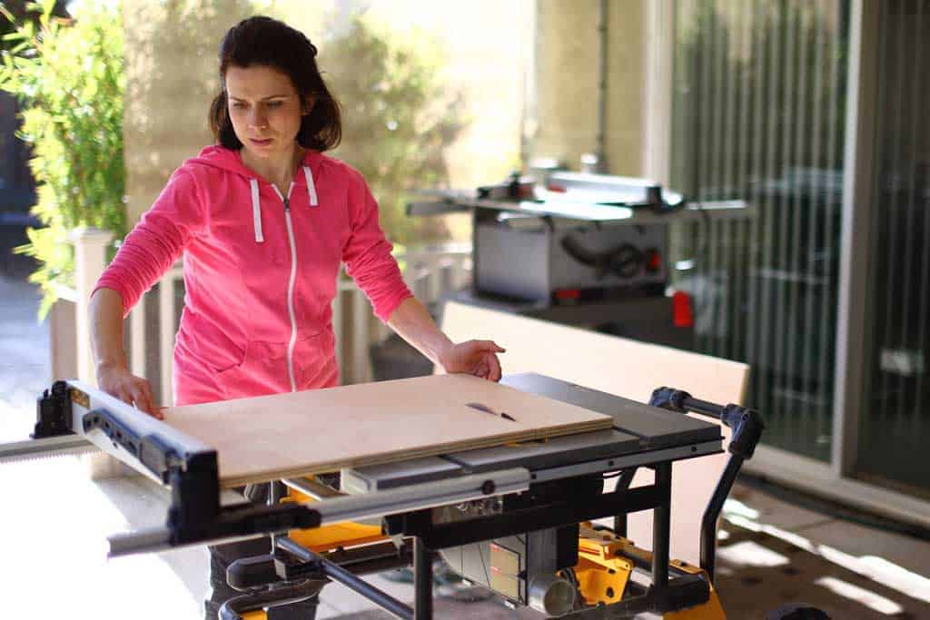 using table saw to cut plywood for DIY Storage for Toys