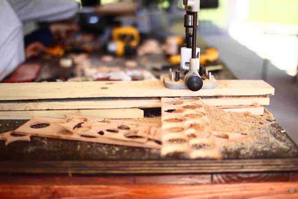 using a hole saw big to make discs for DIY Family Calendar Board