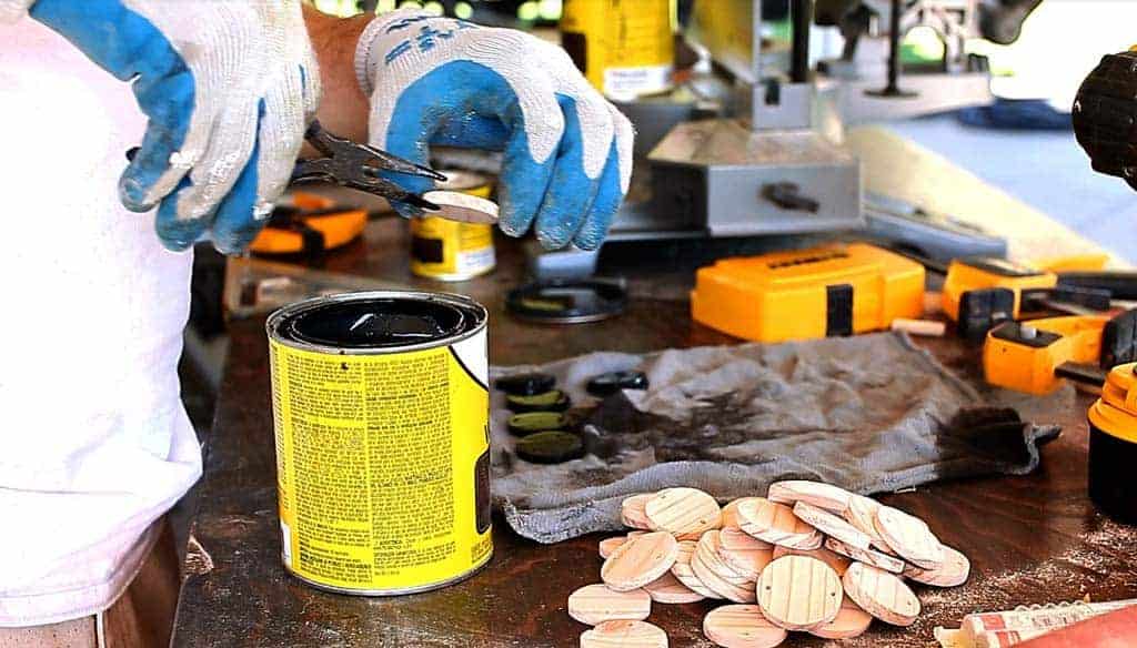 staining the discs for the DIY Family Calendar Board
