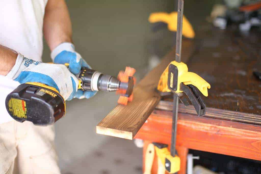 brushing the burnt layer for DIY Wooden Table Centerpiece