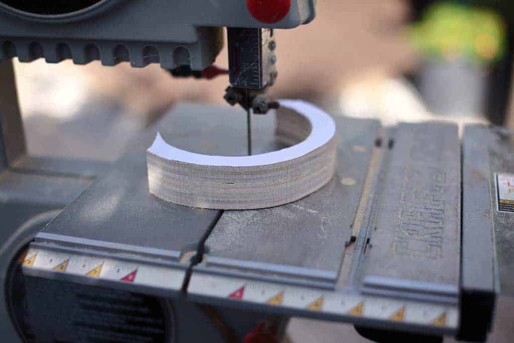 cutting out cloud shapes for DIY Cloud Toilet Paper Storage