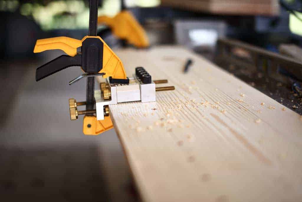 drilling holes for pins on the DIY Cornhole Scoreboard