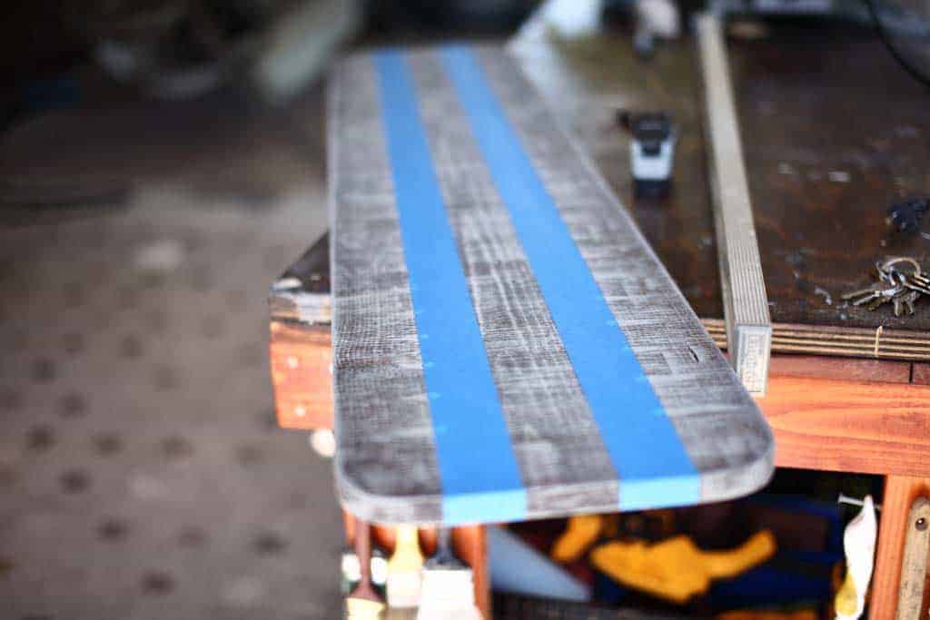 tape section of DIY Cornhole Scoreboard to be painted