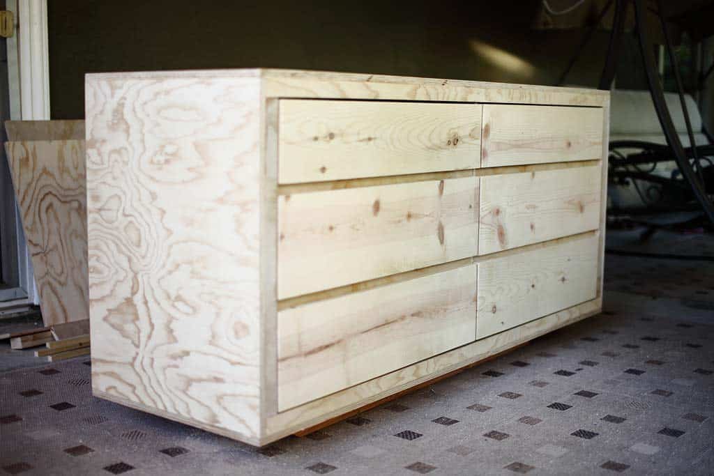 inserting the drawers inside the dresser