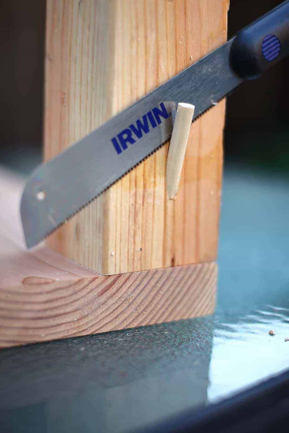 cutting off dowel rod to cover pocket hole