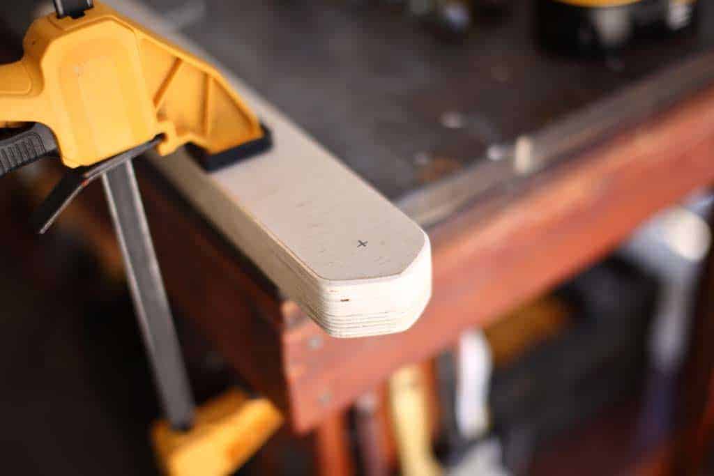 drilling holes in the legs for the DIY Cornhole Boards