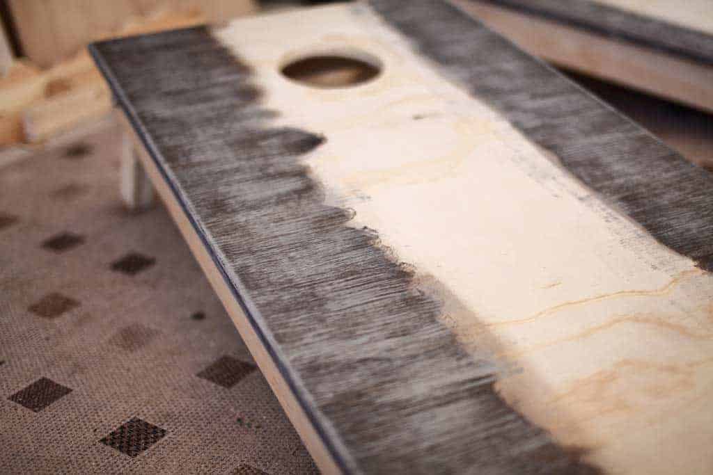 staining DIY Cornhole Boards