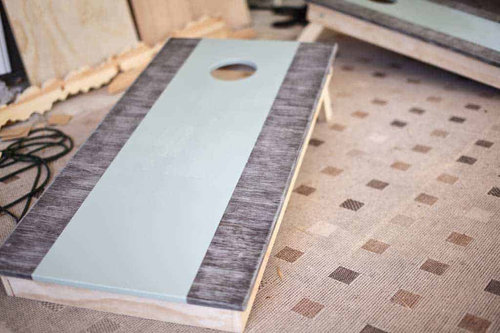 painting DIY Cornhole Boards