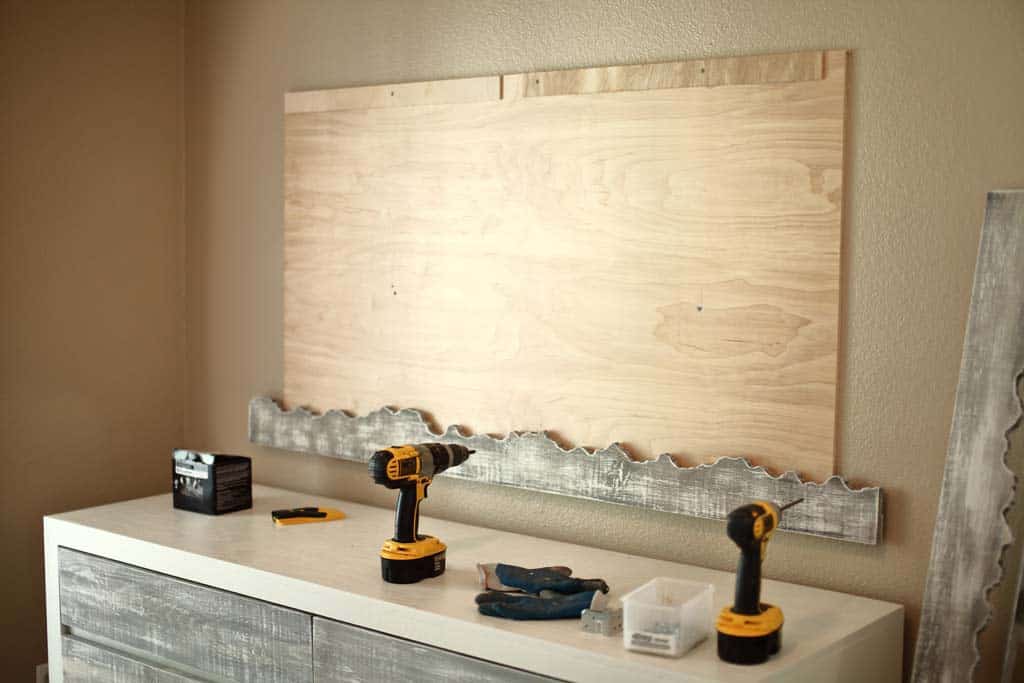 attaching backboard of DIY Live Edge Mirror to wall