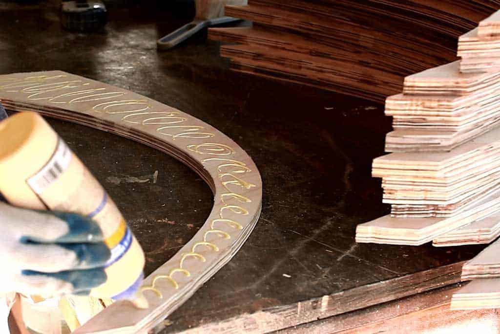 applying wood glue to kitchen legs