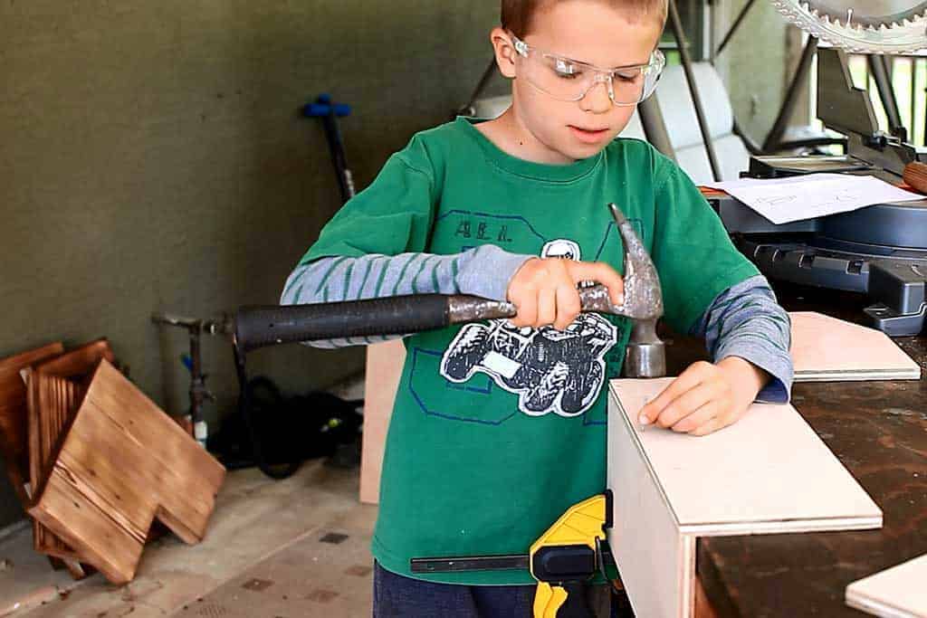 nailing the wooden tool box