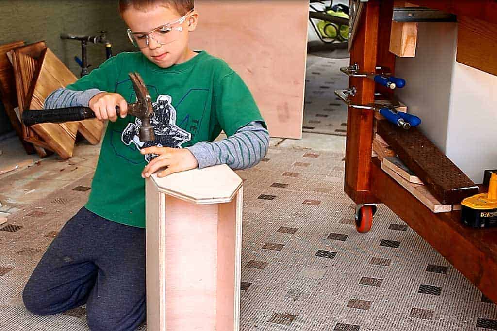 nailing the end piece of the tool box