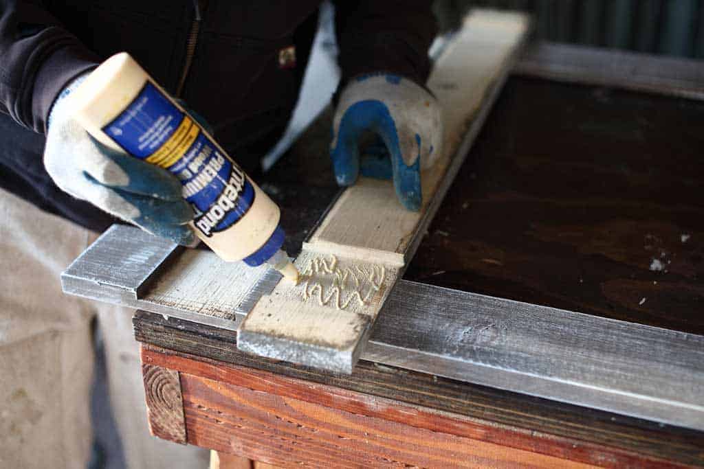 applying wood glue inside the notch