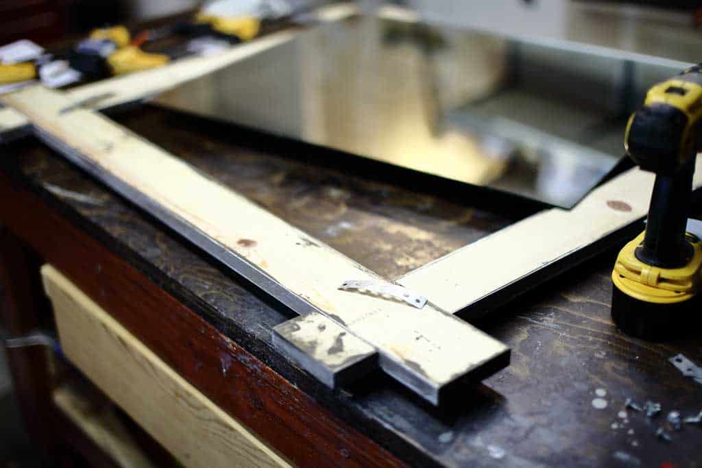 attaching mirror to the frame