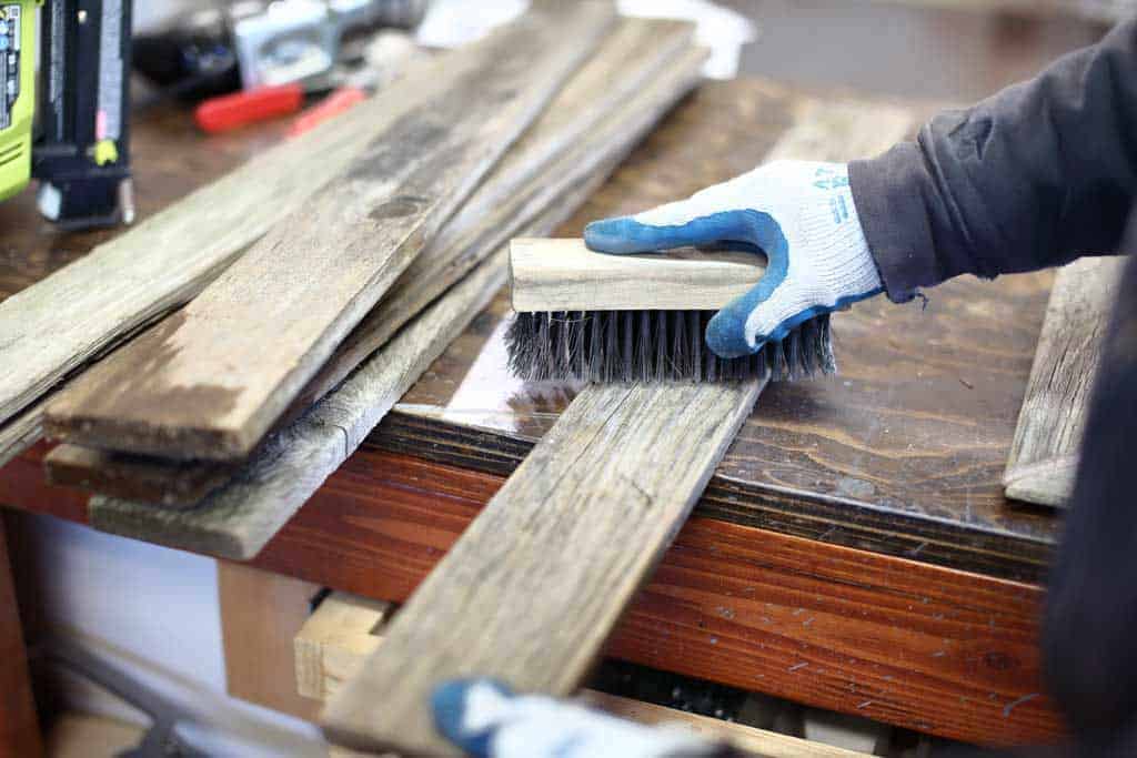 cleaning the wood boards for DIY Reclaimed Wood Frame Sign