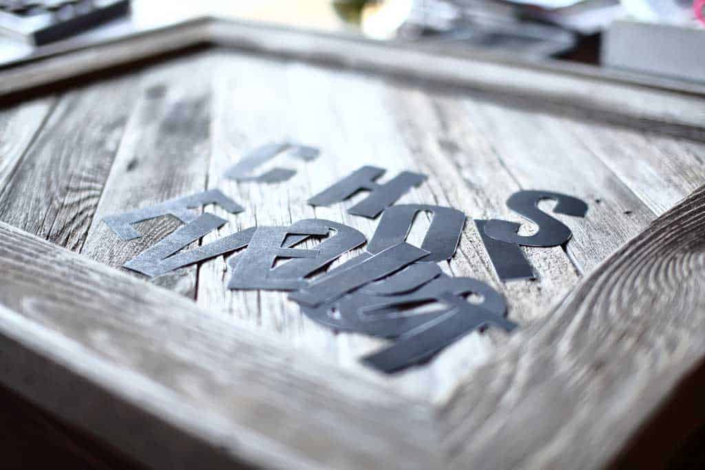 taping letter for DIY Reclaimed Wood Frame Sign