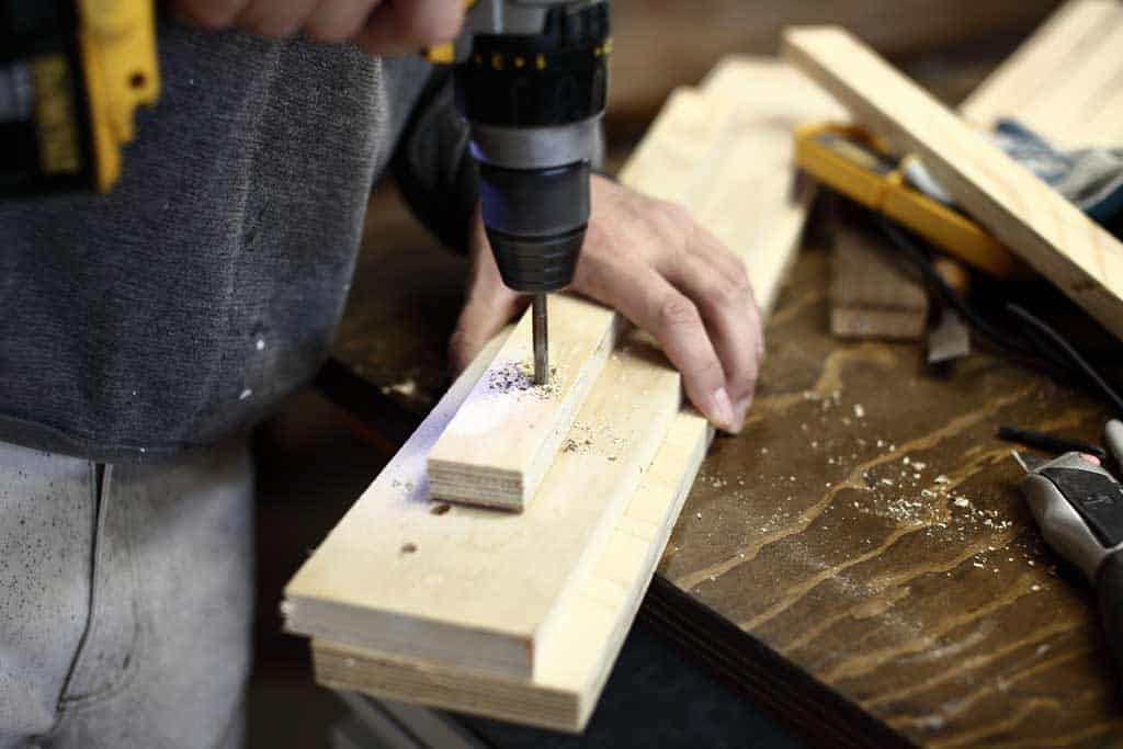 drilling holes for DIY Pucket Game