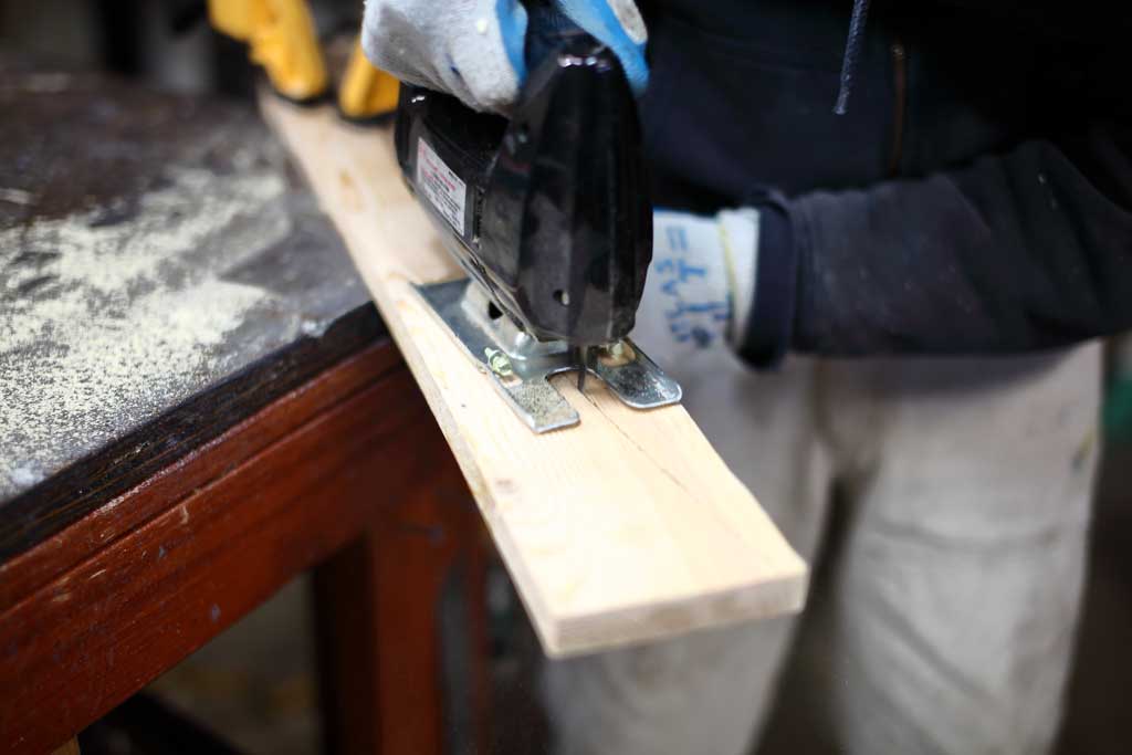 using jig saw to cut out DIY Curved Shelf