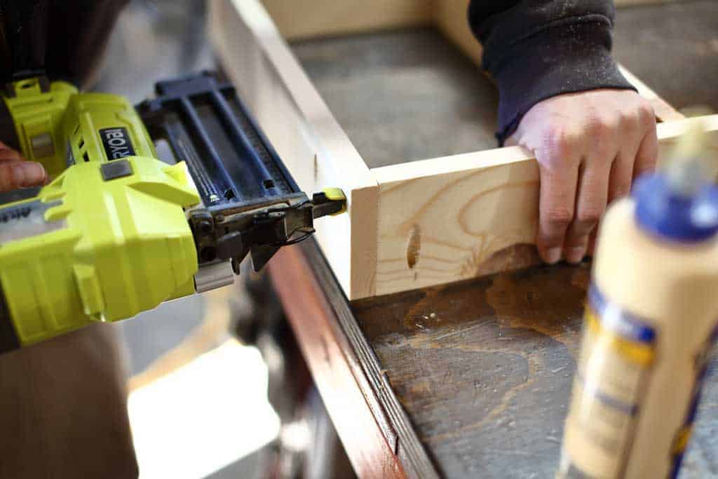 nailing boards together for DIY Back of Door Shelf