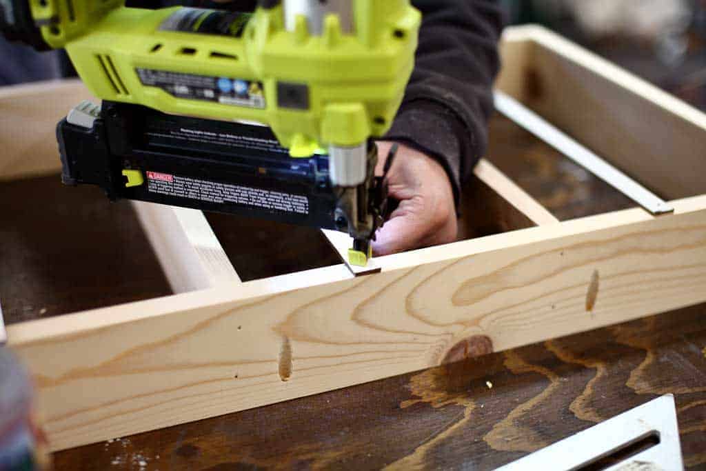 using nail gun for DIY Back of Door Shelf