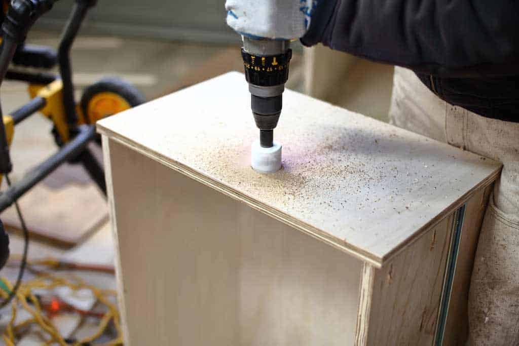 drilling opening for handle of the DIY Mudroom Locker