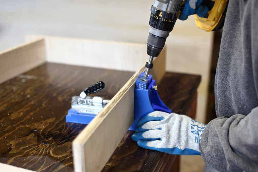 drilling pocket holes for base of the DIY Mudroom Locker