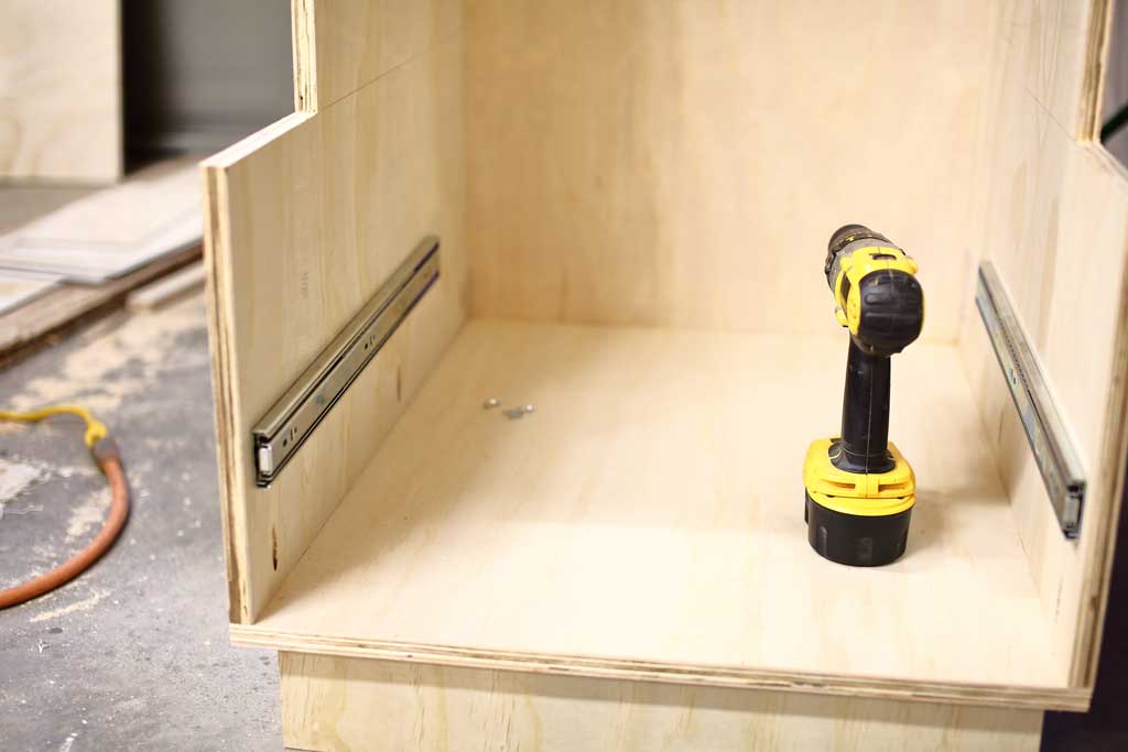 attaching drawer sliders for DIY Mudroom Locker