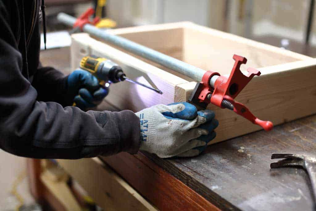 attaching wood for DIY Sensory Table
