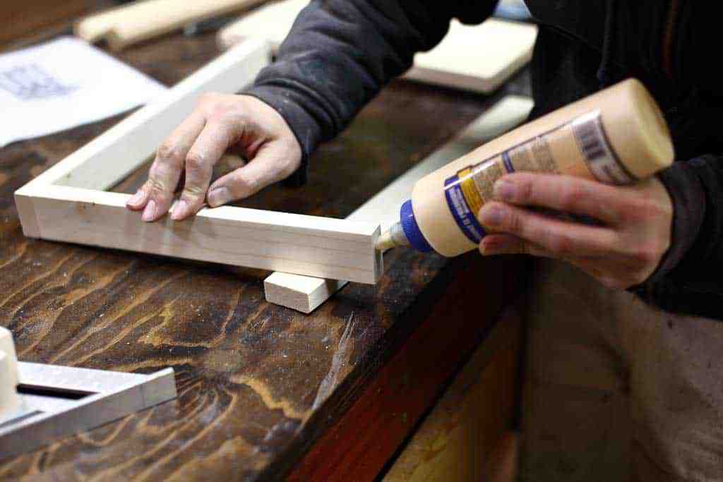 gluing the boards together for the DIY Toddler Step Stool