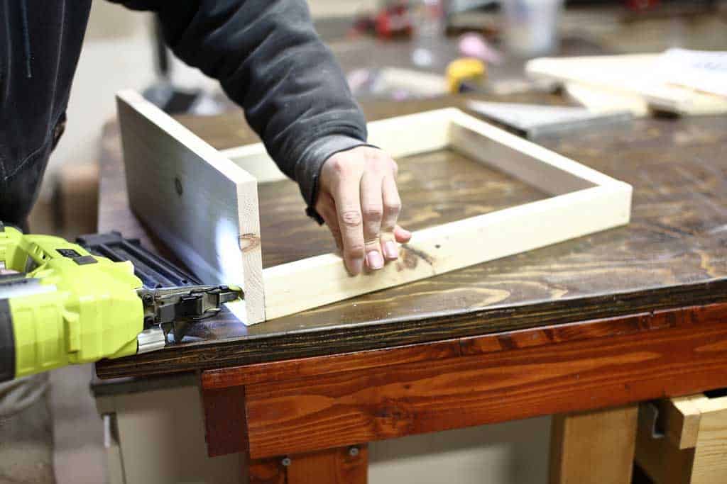 attaching the front board of the DIY Toddler Step Stool
