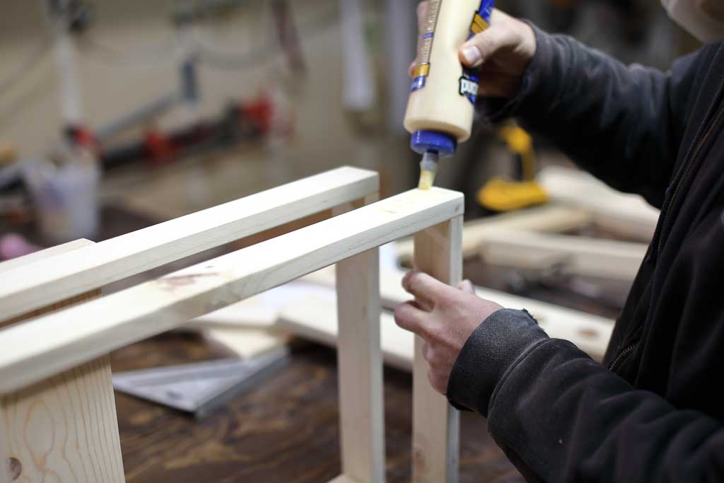 gluing the back leg of the DIY Toddler Step Stool