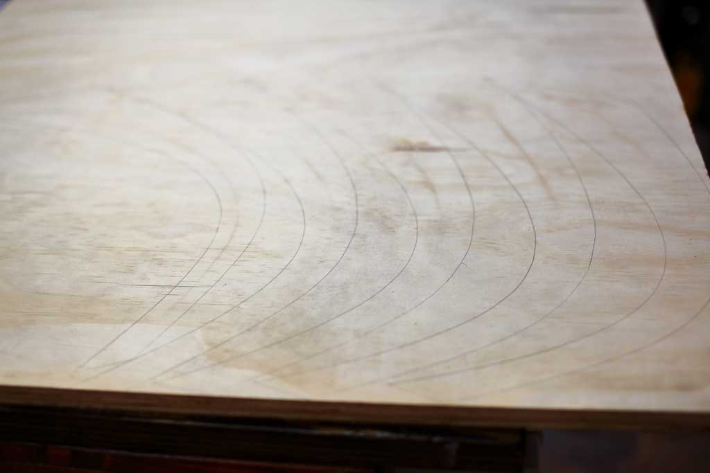 legs drawn on the plywood to be cut out