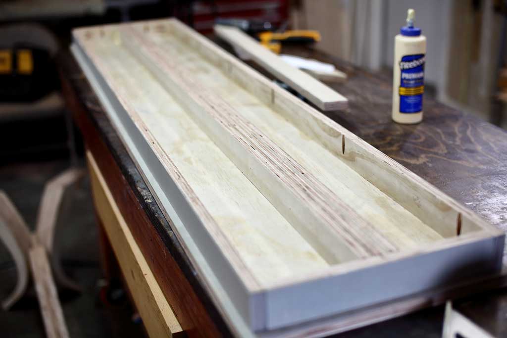 gluing the support rail under the seating