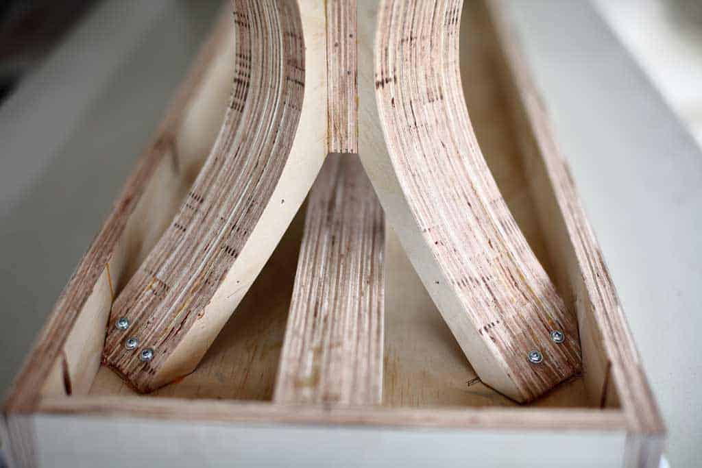 attaching the legs to top board of the bench