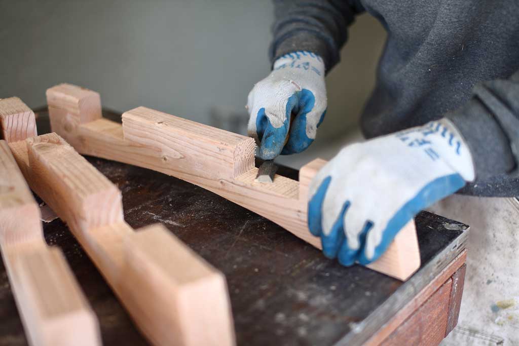 using a wood chisel to carve wood