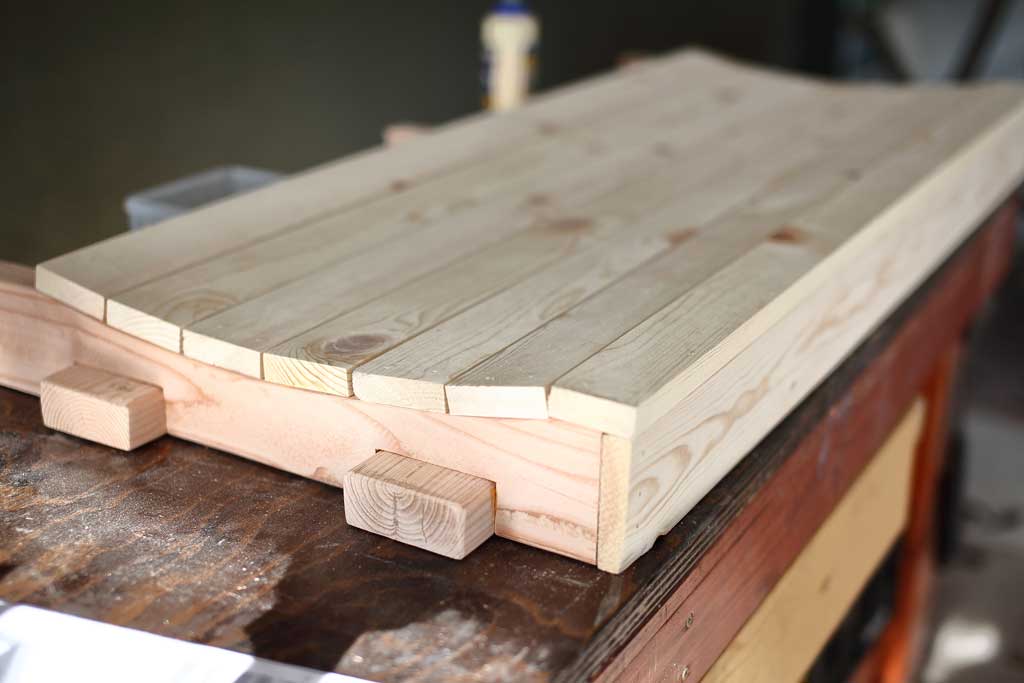 attached wood boards for the DIY Outdoor swing Bench