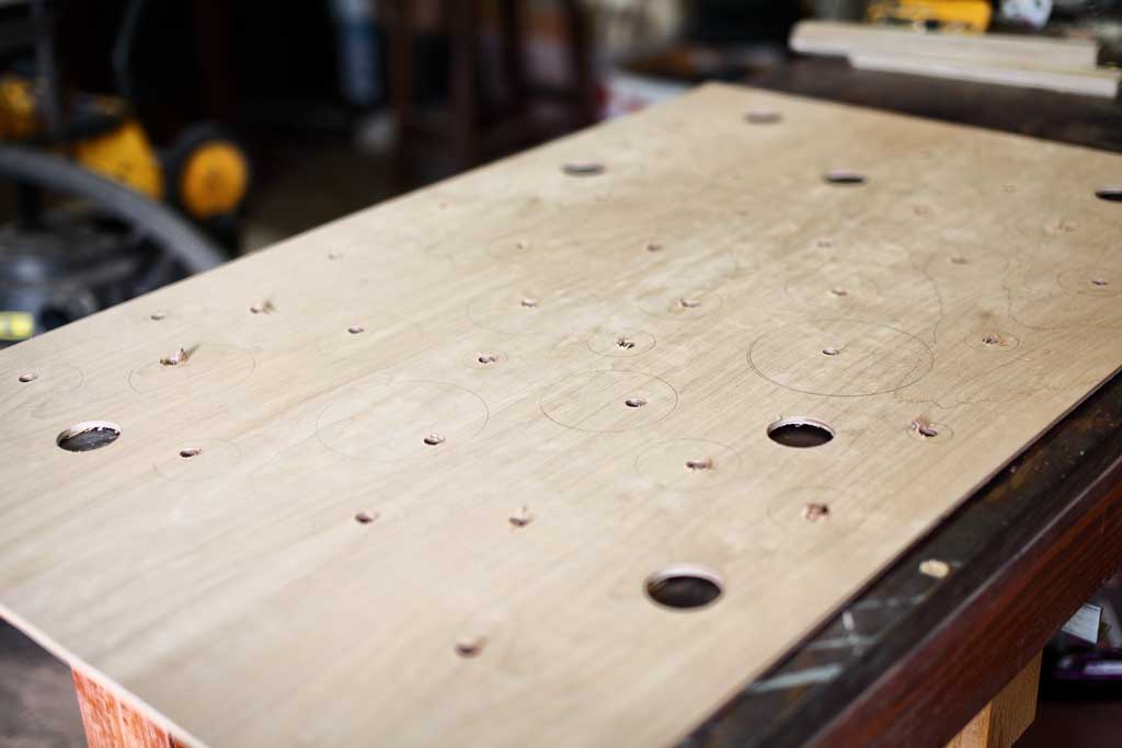 drilling holes in the plywood