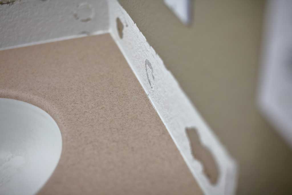 covering gaps between vanity and wall for epoxy