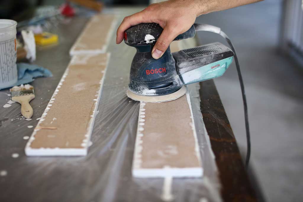 using sander to sand backsplash