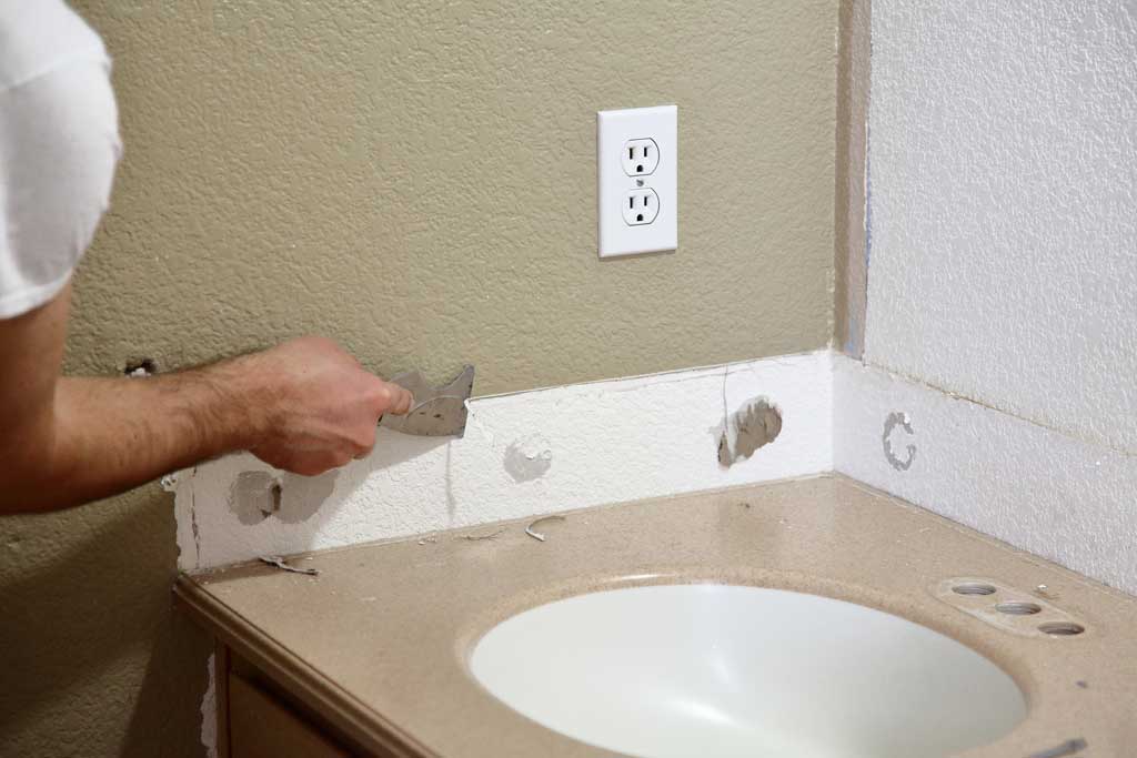 scraping off silicone from wall