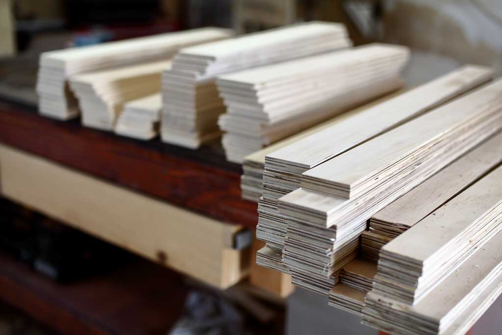 plywood boards cut for DIY plantation shutters