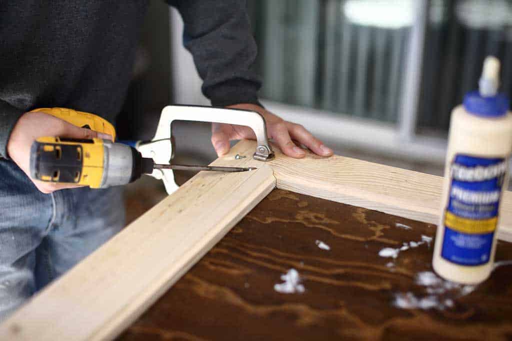 using pocket hole screws to attach DIY mirror frame