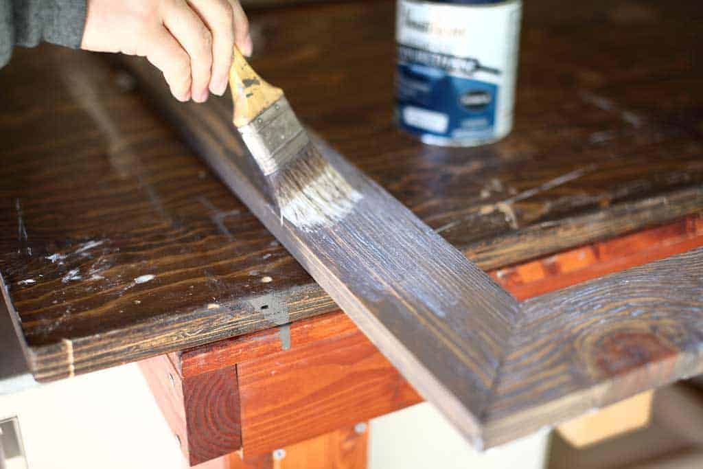 applying polyurethane on DIY mirror frame