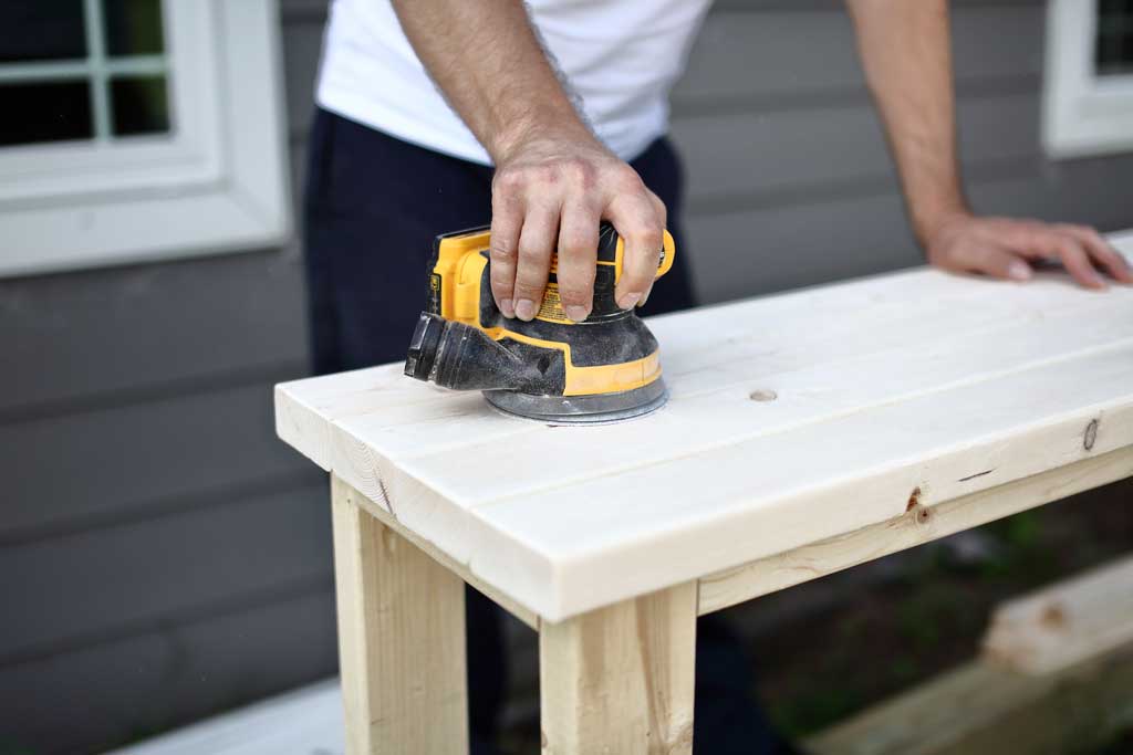 sanding DIY farmhouse entryway table
