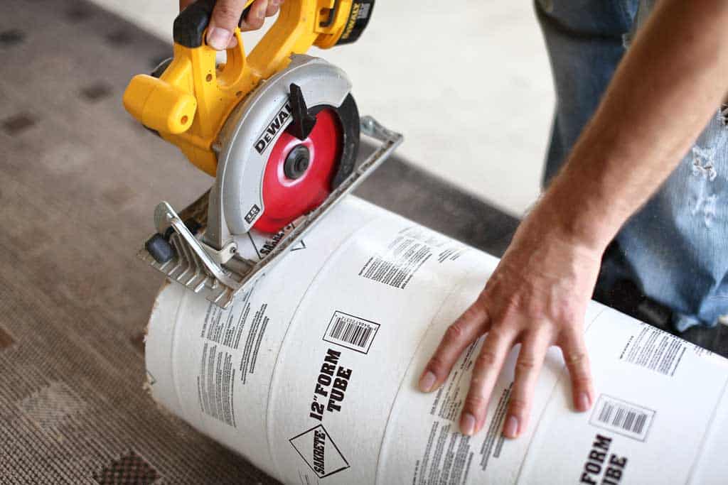 cutting concrete tube with skill saw for diy stepping stone