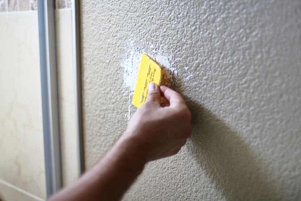 fixing drywall hole in a bathroom