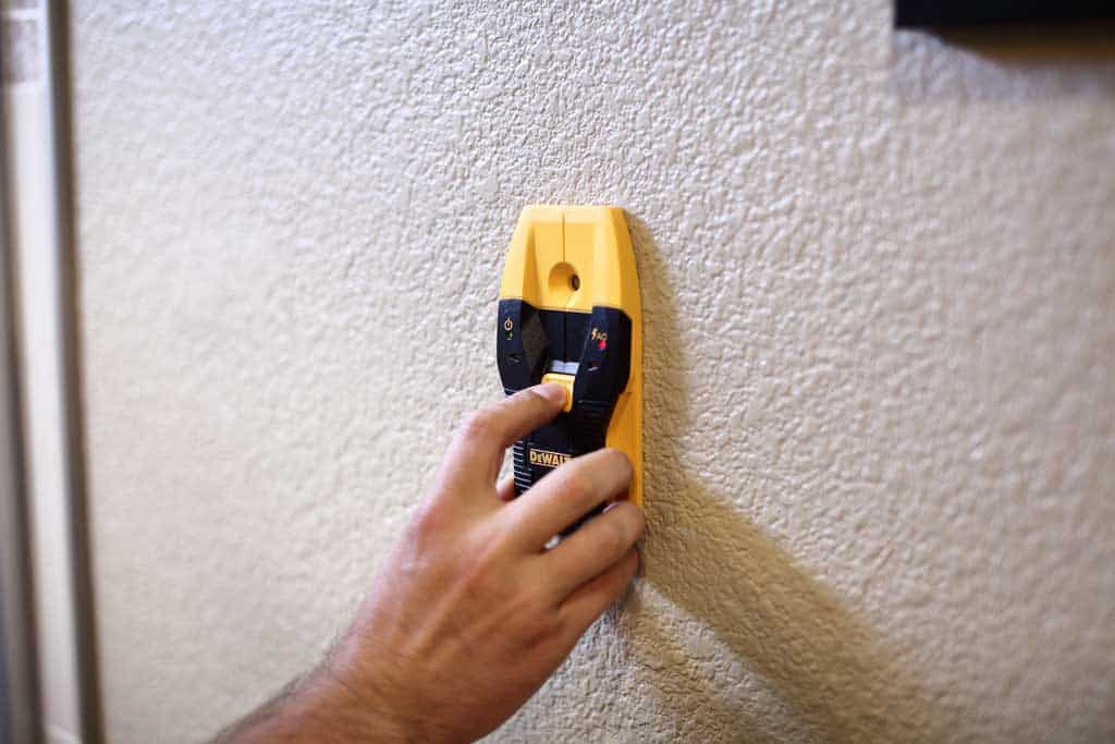 using stud finder for DIY Wooden Towel Bar