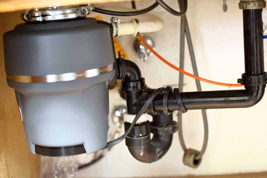 attaching garbage disposal to upper mounting assembly